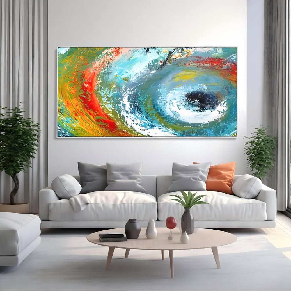 Tablou canvas cu pictura abstracta cu vartej de culori, in rama de aluminiu argintiu, pe perete intr-un living